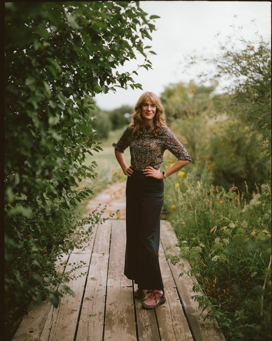 Dr. Anne Metz standing on a wooden footbridge