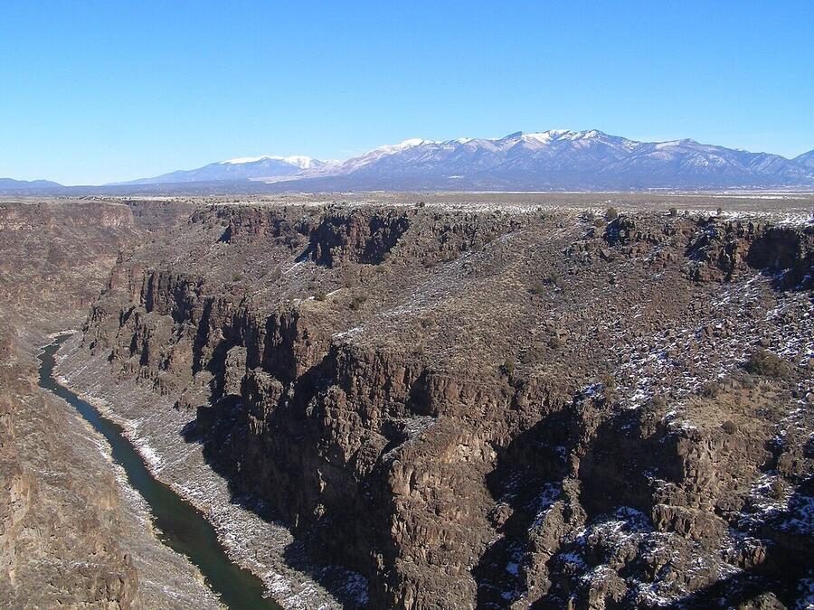 The Rio Grande Gorge with the snow-capped Sangre de Cristo Mountains beyond